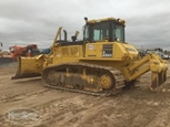Side of used Komatsu Dozer in yard